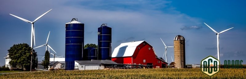 Grain Silos on Farm by Barn